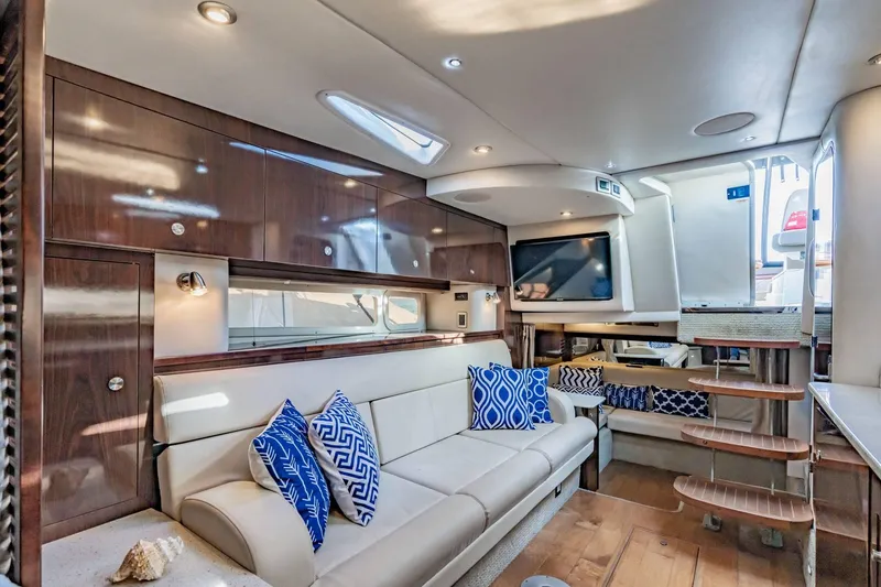 Slide: The Image of Luxurious interior of 2016 Sea Ray 370 Express Cruiser with elegant seating and modern decor. - 38