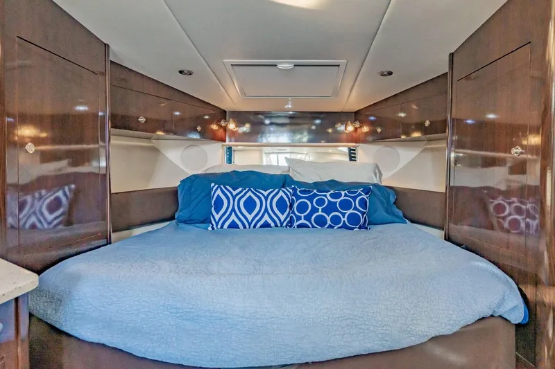 Slide: The Image of Luxurious cabin interior of 2016 Sea Ray 370 Express Cruiser with cozy bedding. - 42