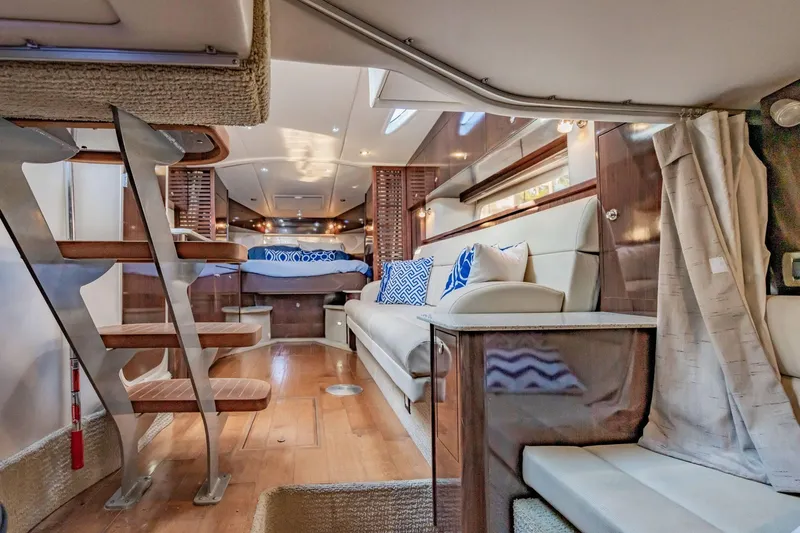 Slide: The Image of Luxurious interior of 2016 Sea Ray 370 Express Cruiser with modern furnishings and elegant design. - 47