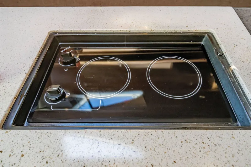 Slide: The Image of Built-in stovetop on 2016 Sea Ray 370 Express Cruiser yacht kitchen. - 49