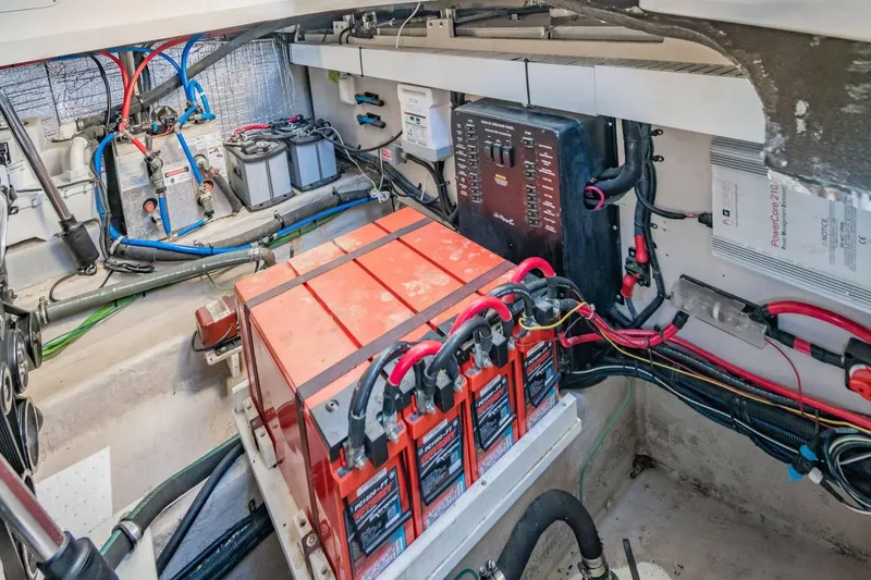 Slide: The Image of Engine room of 2016 Sea Ray 370 Express Cruiser with batteries and wiring. - 62