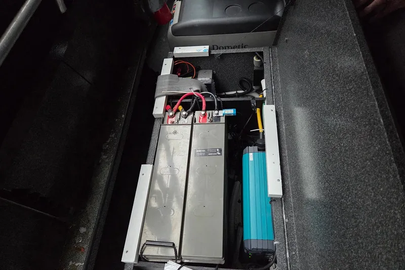 Slide: The Image of Battery compartment of a 2008 Alumaweld 22 Intruder boat, featuring electrical components. - 11