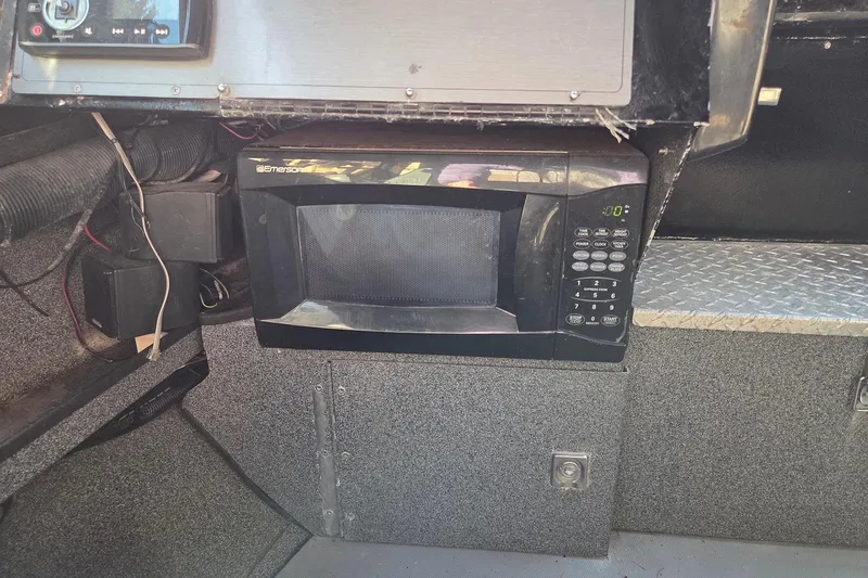 Slide: The Image of 2008 Alumaweld 22 Intruder interior with built-in Emerson microwave. - 13