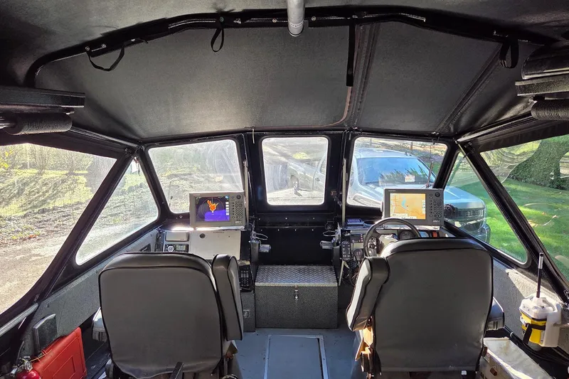 Slide: The Image of Interior of a 2008 Alumaweld 22 Intruder boat with navigation equipment. - 7