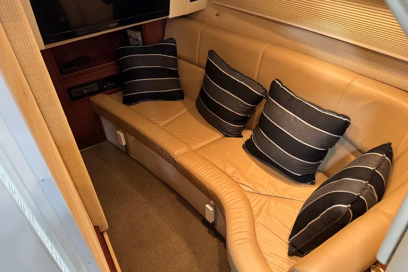 Slide: The Image of Luxurious interior of 2016 Cobalt 336 boat with leather seating and striped cushions. - 16