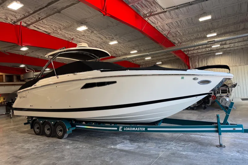 Slide: The Image of 2016 Cobalt 336 boat on Loadmaster trailer in indoor storage facility. - 19