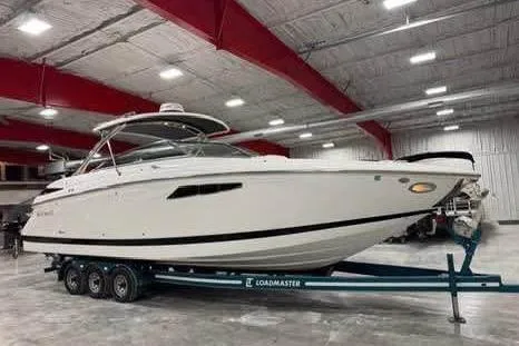 Slide: The Image of 2016 Cobalt 336 boat on Loadmaster trailer in indoor storage facility. - 23