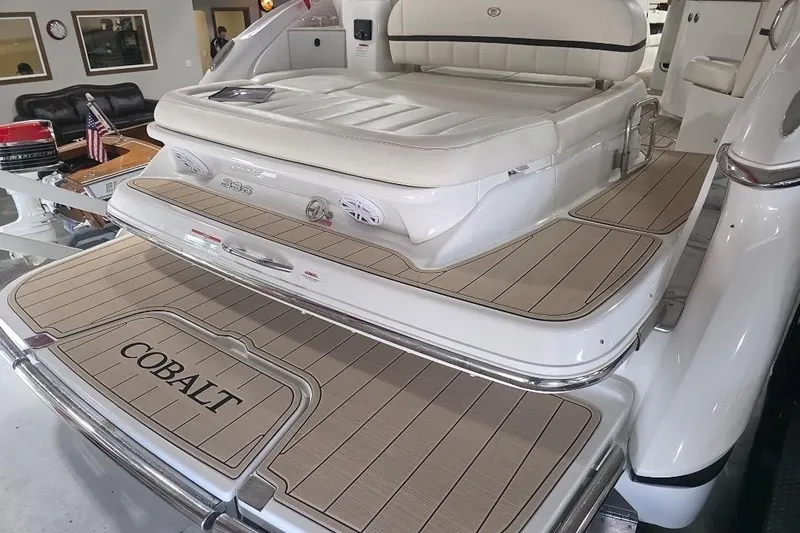 Slide: The Image of 2016 Cobalt 336 boat with teak deck and cushioned seating in showroom. - 31