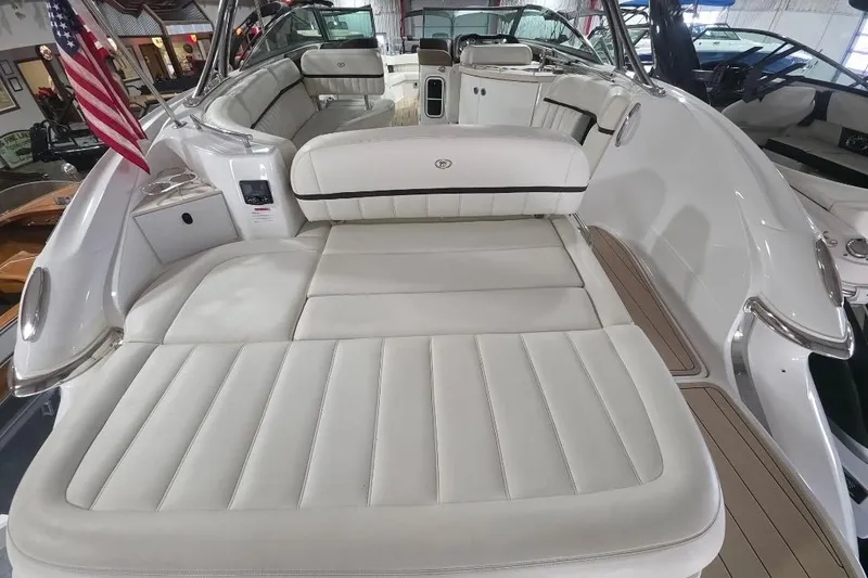 Slide: The Image of 2016 Cobalt 336 boat interior with luxurious white seating and American flag. - 32