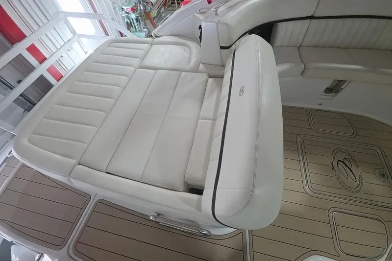 Slide: The Image of 2016 Cobalt 336 boat interior with white leather seating and teak flooring. - 34