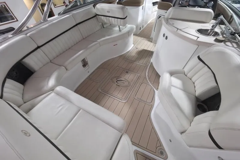 Slide: The Image of Luxurious interior of a 2016 Cobalt 336 boat with white seating and wood flooring. - 37