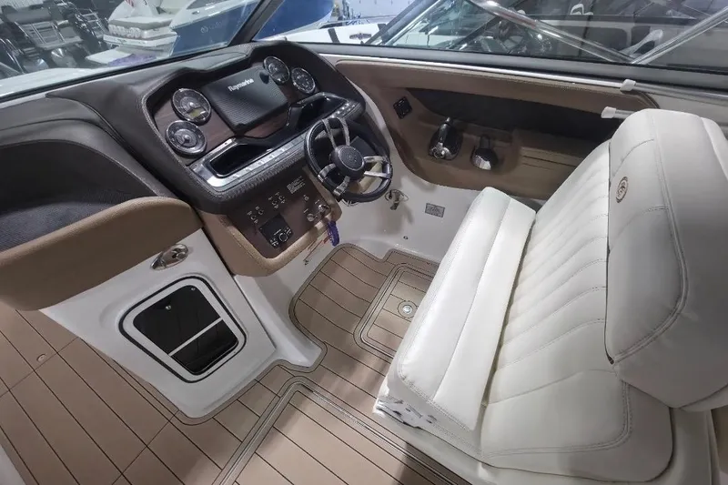 Slide: The Image of Interior of a 2016 Cobalt 336 boat, featuring a sleek dashboard and plush seating. - 39