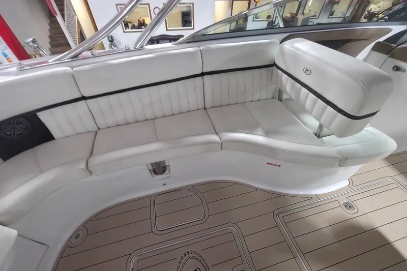 Slide: The Image of 2016 Cobalt 336 boat interior with white leather seating and teak flooring. - 40