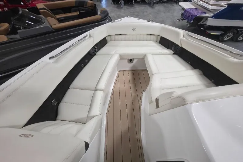 Slide: The Image of 2016 Cobalt 336 boat interior with white leather seating and wood flooring. - 41