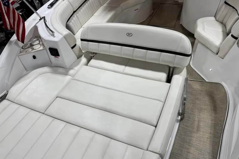 Slide: The Image of Luxurious interior of 2016 Cobalt 336 boat with white leather seating and American flag. - 6