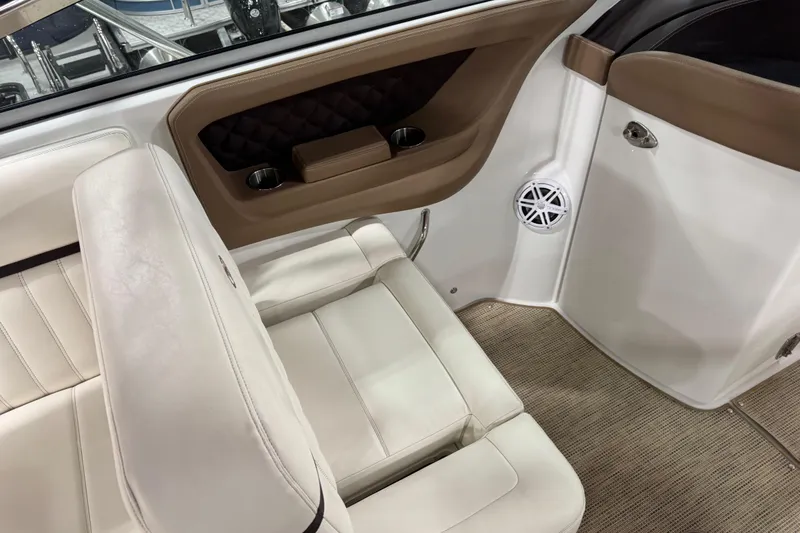 Slide: The Image of Interior of a 2016 Cobalt 336 boat with beige seating and speaker. - 9