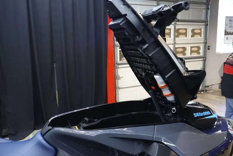 Slide: The Image of 2026 Sea-Doo GTX 230 with open front compartment in a garage. - 14