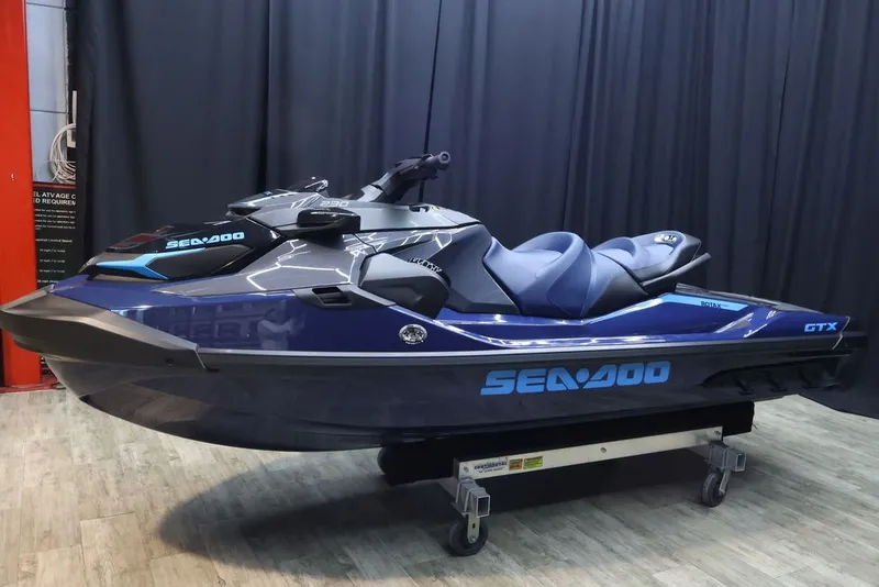 Slide: The Image of 2026 Sea-Doo GTX 230 jet ski in showroom. - 3