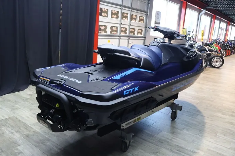 Slide: The Image of 2026 Sea-Doo GTX 230 jet ski in a showroom. - 6