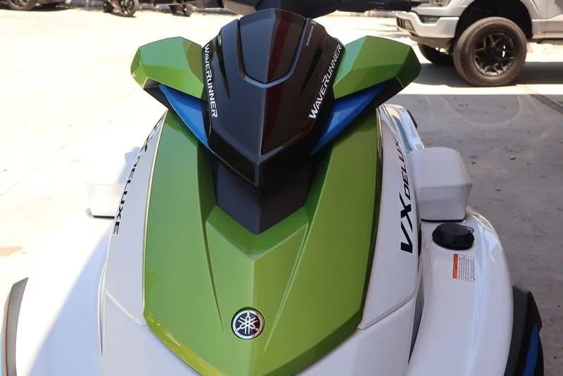 Slide: The Image of 2026 Yamaha WaveRunners VX Deluxe with Audio, green and black design. - 12
