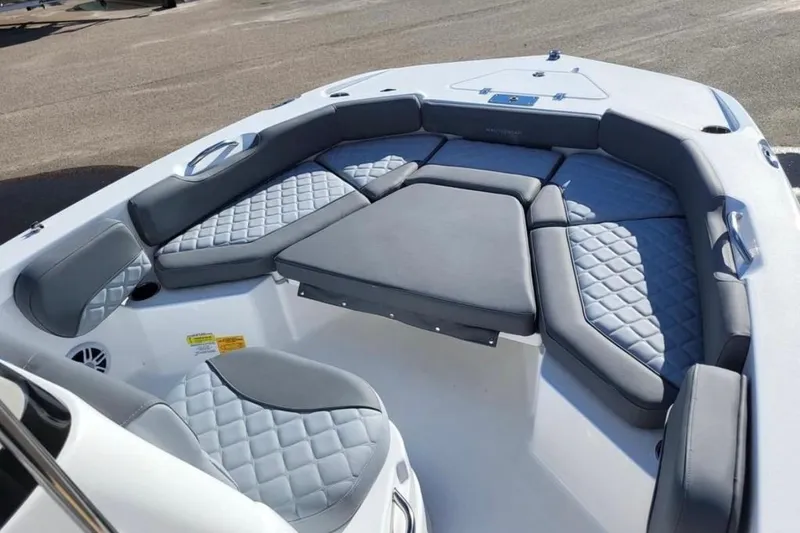 Slide: The Image of 2025 NauticStar 191 Hybrid boat interior with cushioned seating and modern design. - 8