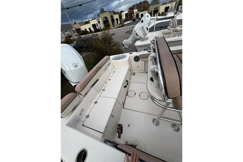 Slide: The Image of 2023 Sea Chaser 20 HFC boat interior with seating and Suzuki outboard motor. - 6