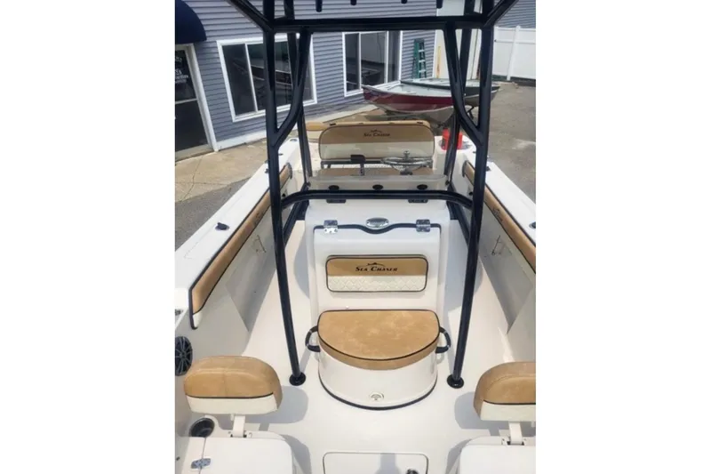 Slide: The Image of 2023 Sea Chaser 22 HFC boat interior with tan seating and black frame. - 6