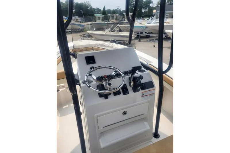 Slide: The Image of 2023 Sea Chaser 22 HFC boat console with steering wheel and controls. - 8