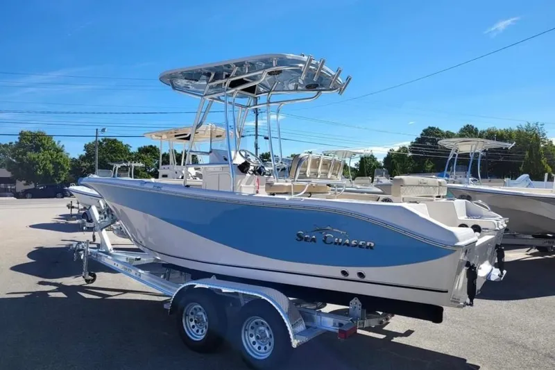 Slide: The Image of 2023 Sea Chaser 22 HFC boat on trailer under clear blue sky. - 3