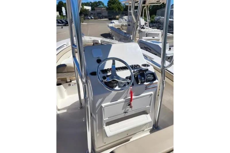 Slide: The Image of 2023 Sea Chaser 22 HFC boat console with steering wheel and controls. - 7
