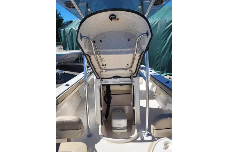 Slide: The Image of 2023 Sea Chaser 22 HFC boat interior with storage compartment and seating. - 9
