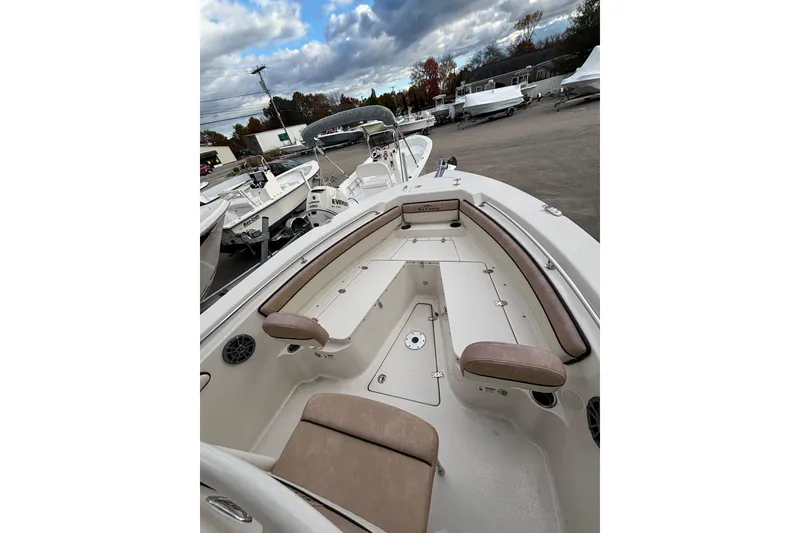 Slide: The Image of 2023 Sea Chaser 24 HFC boat interior with cushioned seating and storage compartments. - 10