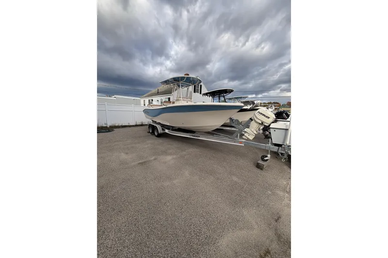 Slide: The Image of 2023 Sea Chaser 24 HFC boat on trailer under cloudy sky. - 3