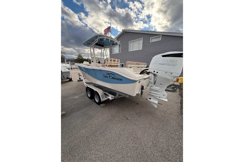 Slide: The Image of 2023 Sea Chaser 24 HFC boat on trailer with Suzuki outboard motor. - 4