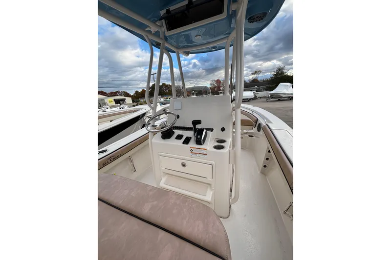 Slide: The Image of 2023 Sea Chaser 24 HFC boat console with steering wheel and controls. - 7