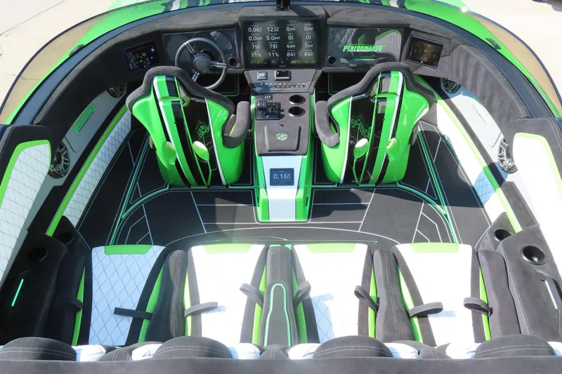 Slide: The Image of 2025 Performance Powerboats P360 dashboard with digital display and steering wheel. - 12