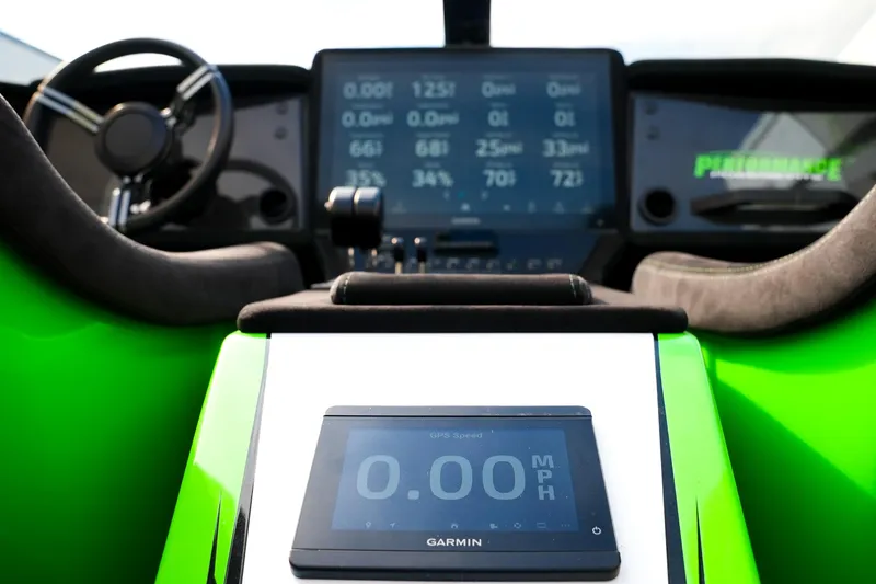 Slide: The Image of Interior of 2025 Performance Powerboats P360 with digital dashboard and Garmin GPS display. - 16