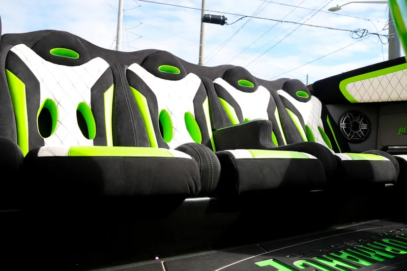 Slide: The Image of Interior of 2025 Performance Powerboats P360 with vibrant green and black seating design. - 22