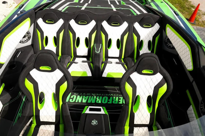 Slide: The Image of 2025 Performance Powerboats P360 interior with vibrant green and white seating design. - 27