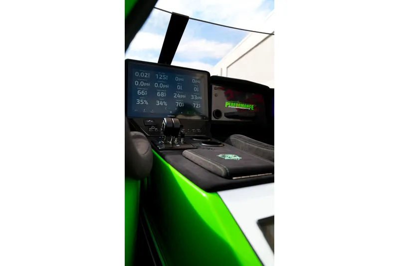Slide: The Image of 2025 Performance Powerboats P360 cockpit with digital dashboard and controls. - 44