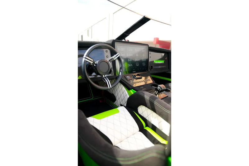 Slide: The Image of 2025 Performance Powerboats P360 cockpit with modern steering and digital dashboard. - 48