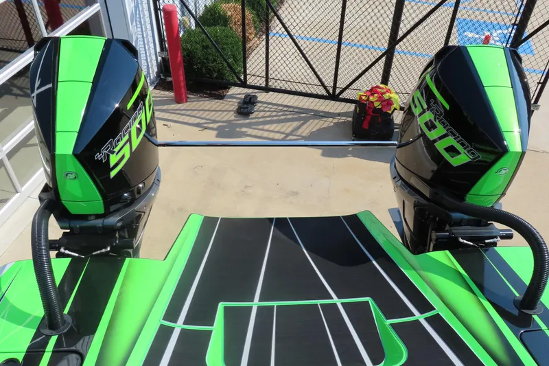 Slide: The Image of Interior of 2025 Performance Powerboats P360, featuring modern dashboard and vibrant green seating. - 5