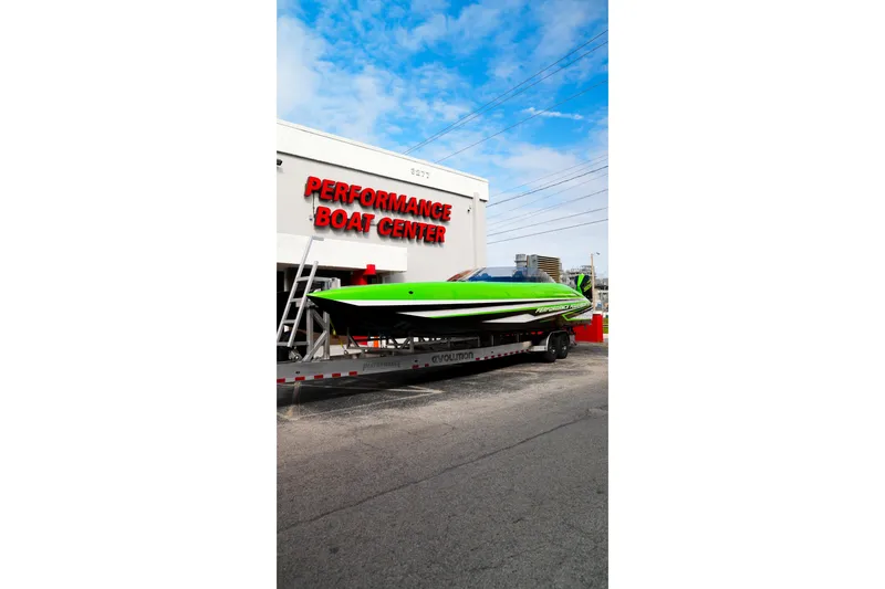 Slide: The Image of 2025 Performance Powerboats P360 in vibrant green at Performance Boat Center. - 53