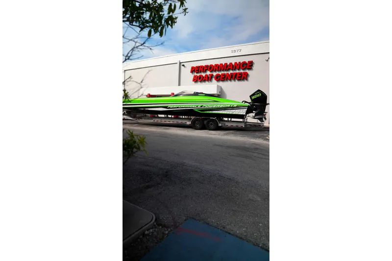 Slide: The Image of 2025 Performance Powerboats P360 in vibrant green at Performance Boat Center. - 56