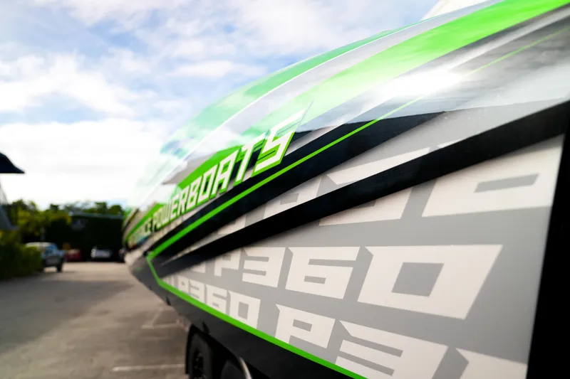 Slide: The Image of 2025 Performance Powerboats P360 with sleek design and vibrant green accents. - 61