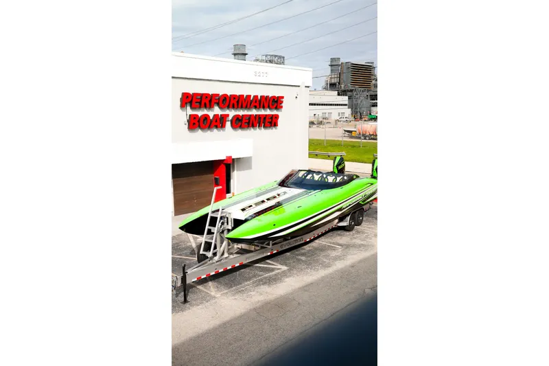 Slide: The Image of 2025 Performance Powerboats P360 in vibrant green at Performance Boat Center. - 62