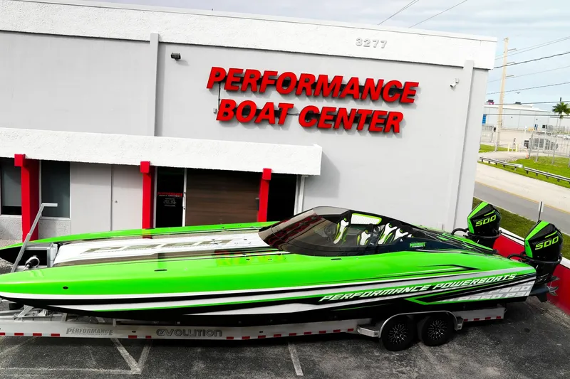 Slide: The Image of 2025 Performance Powerboats P360 in vibrant green at Performance Boat Center. - 64