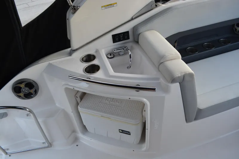 Slide: The Image of Interior of 2016 Regal 28 Express boat with seating and cooler storage. - 12