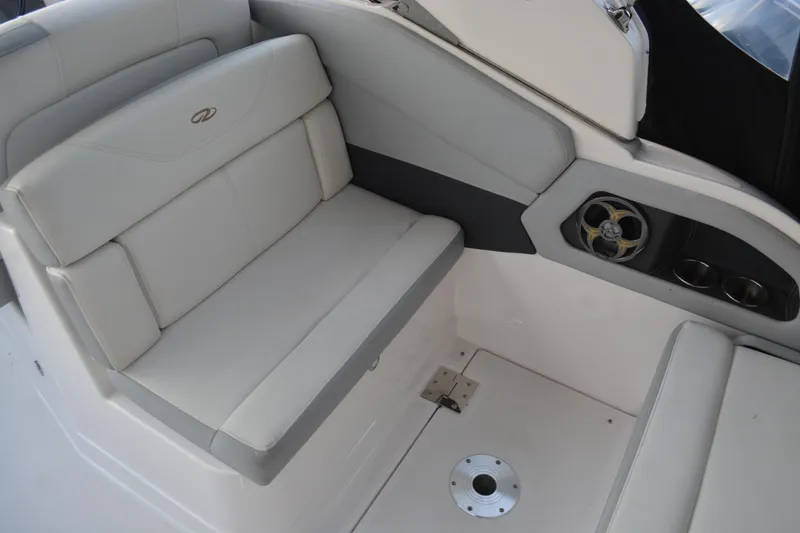 Slide: The Image of 2016 Regal 28 Express boat interior with cushioned seating and speaker system. - 14