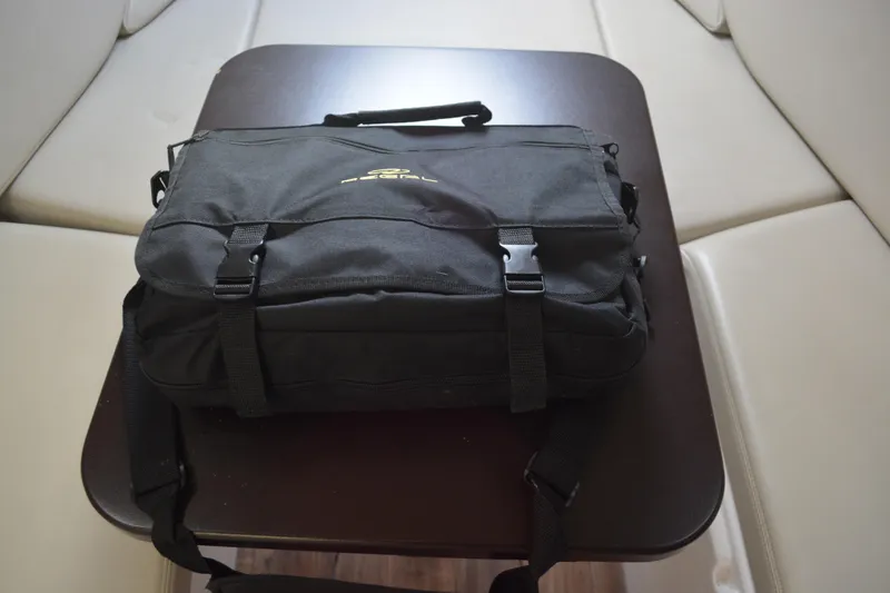 Slide: The Image of Black bag on a table inside a 2016 Regal 28 Express boat. - 18